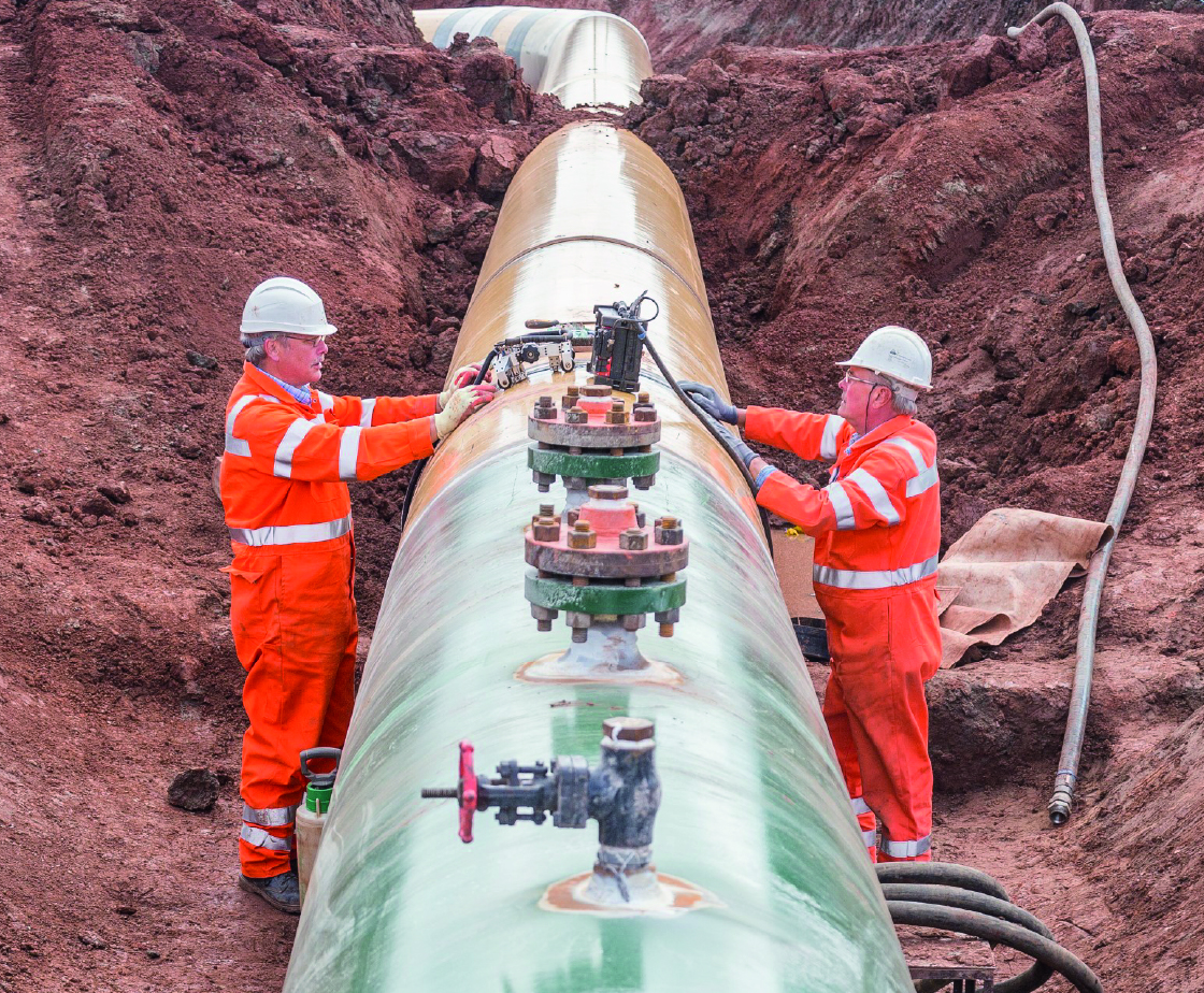 workmen laying new energy pipelines