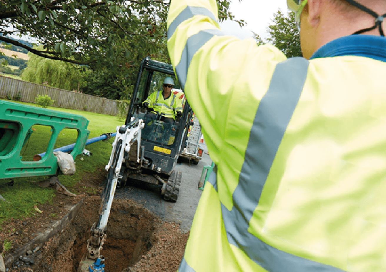 infrastructure employees digging on street