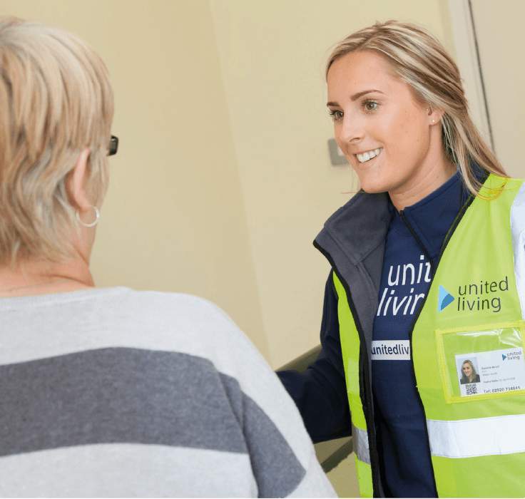 employee speaking with a local resident