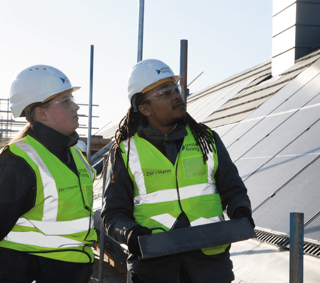 employees reviewing net zero retrofit works on home