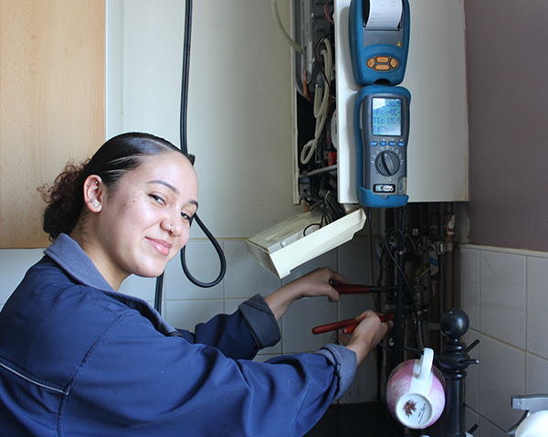 employee fixing boiler
