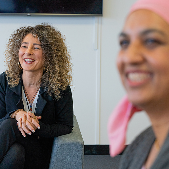 employees chatting and laughing